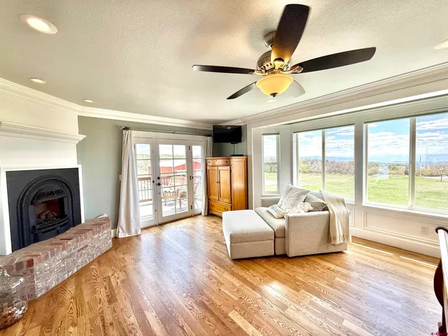 a spacious bedroom with a large bed and a large window