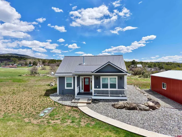 a living room with furniture fireplace and flat screen tv
