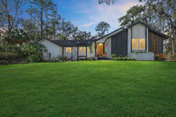 a view of a house with a yard