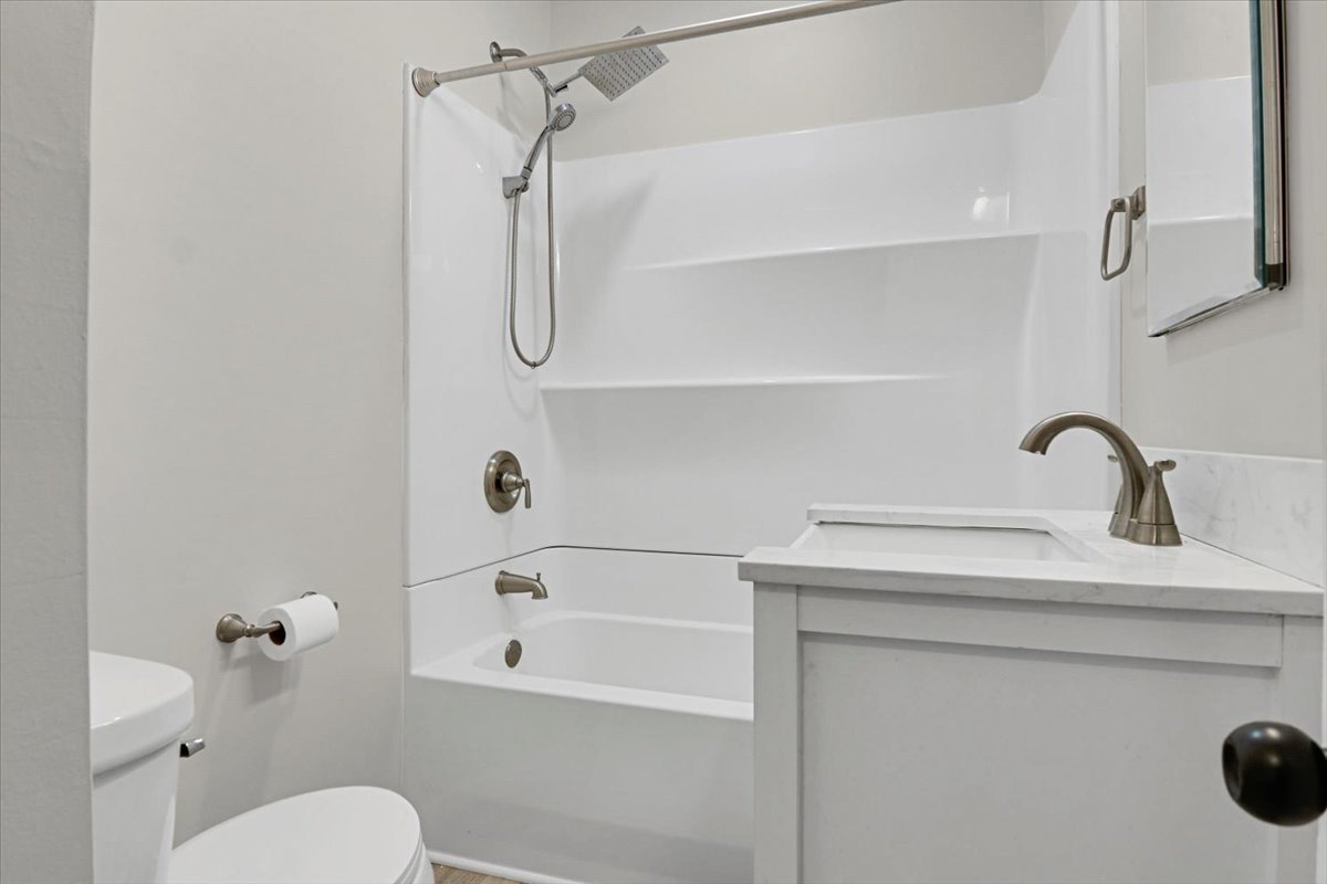 705 Cullom Street Normal, IL 61761 - Photo 9 of 15 a bathroom with a sink a toilet and shower