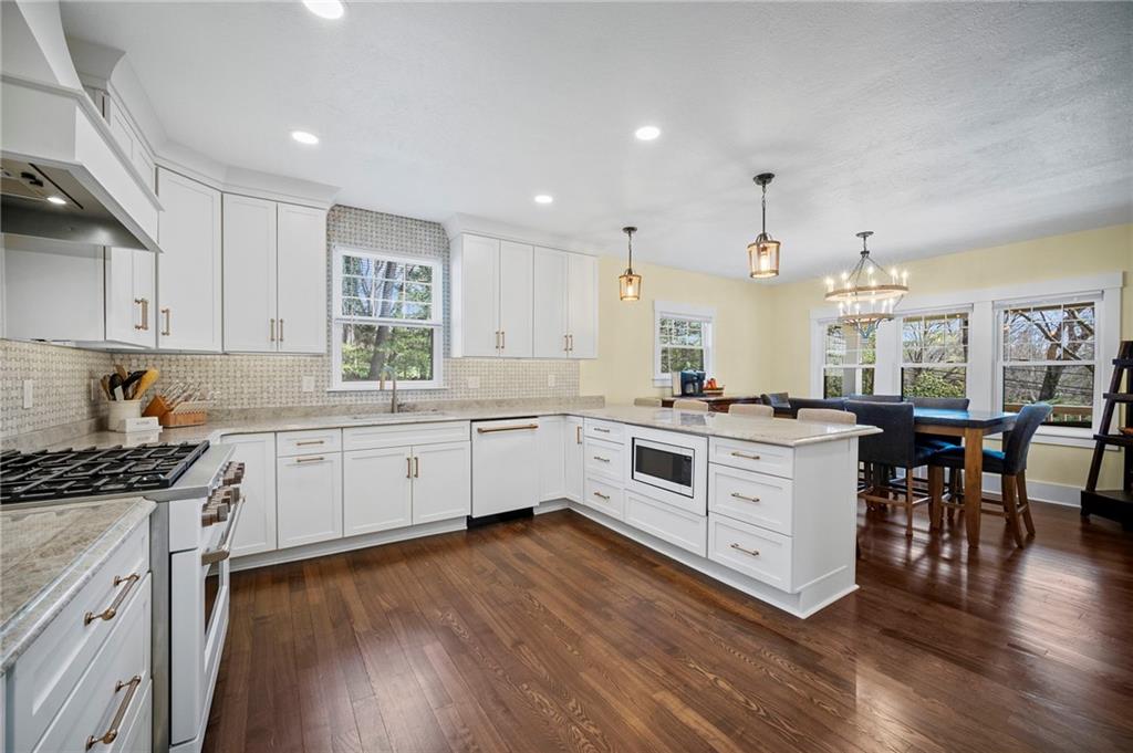 3252 Comanche Road Upper St. Clair, PA 15241 - Photo 12 of 50 a kitchen with a white cabinets and wooden floor