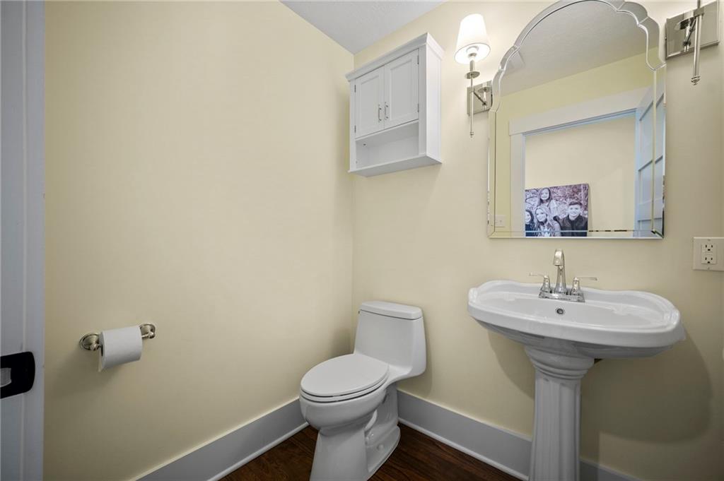 3252 Comanche Road Upper St. Clair, PA 15241 - Photo 19 of 50 a bathroom with a sink mirror and toilet
