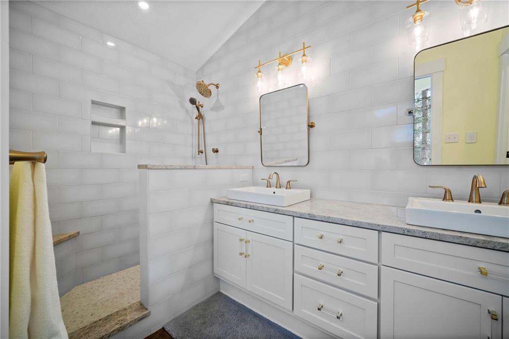 3252 Comanche Road Upper St. Clair, PA 15241 - Photo 21 of 50 a bathroom with a double vanity sink mirror and shower