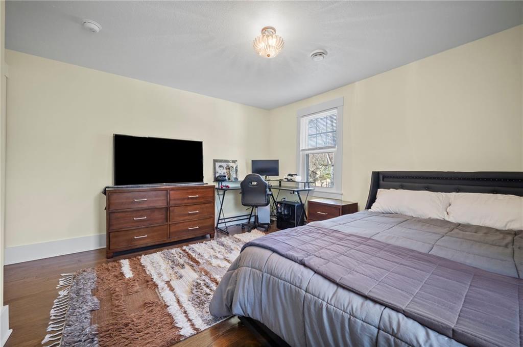 3252 Comanche Road Upper St. Clair, PA 15241 - Photo 26 of 50 a bedroom with a bed and a flat screen tv