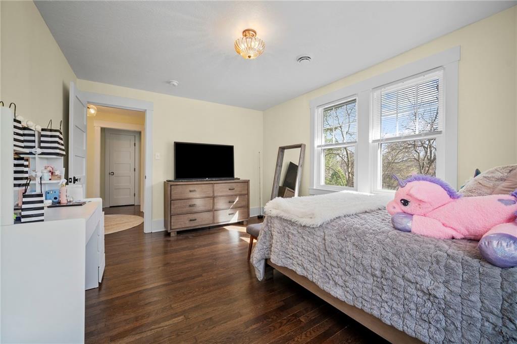 3252 Comanche Road Upper St. Clair, PA 15241 - Photo 29 of 50 a bedroom with a bed and a flat screen tv