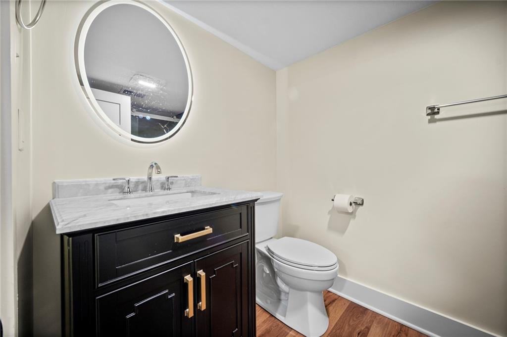 3252 Comanche Road Upper St. Clair, PA 15241 - Photo 35 of 50 a bathroom with a toilet a sink and mirror