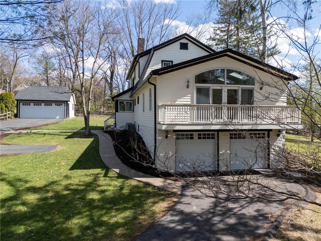 3252 Comanche Road Upper St. Clair, PA 15241 - Photo 40 of 50 a front view of a house with a yard