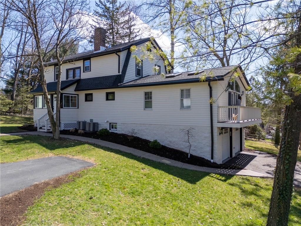 3252 Comanche Road Upper St. Clair, PA 15241 - Photo 41 of 50 a view of a house with swimming pool in front of it