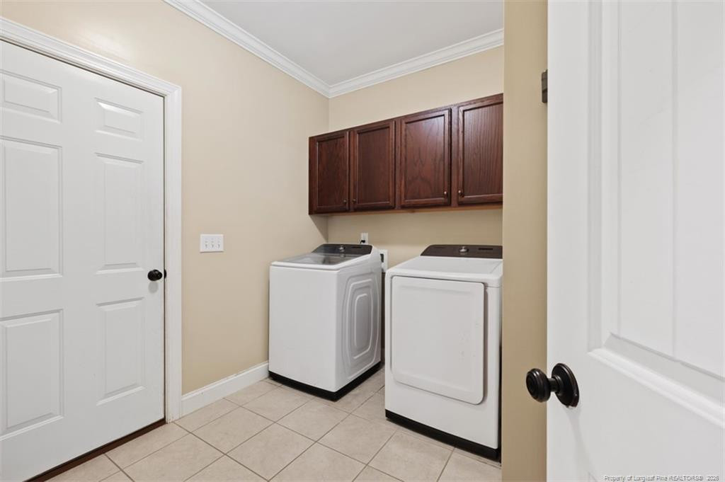 704 Micahs Way North Spring Lake, NC 28390 - Photo 26 of 43 a view of storage and utility room with washer and dryer