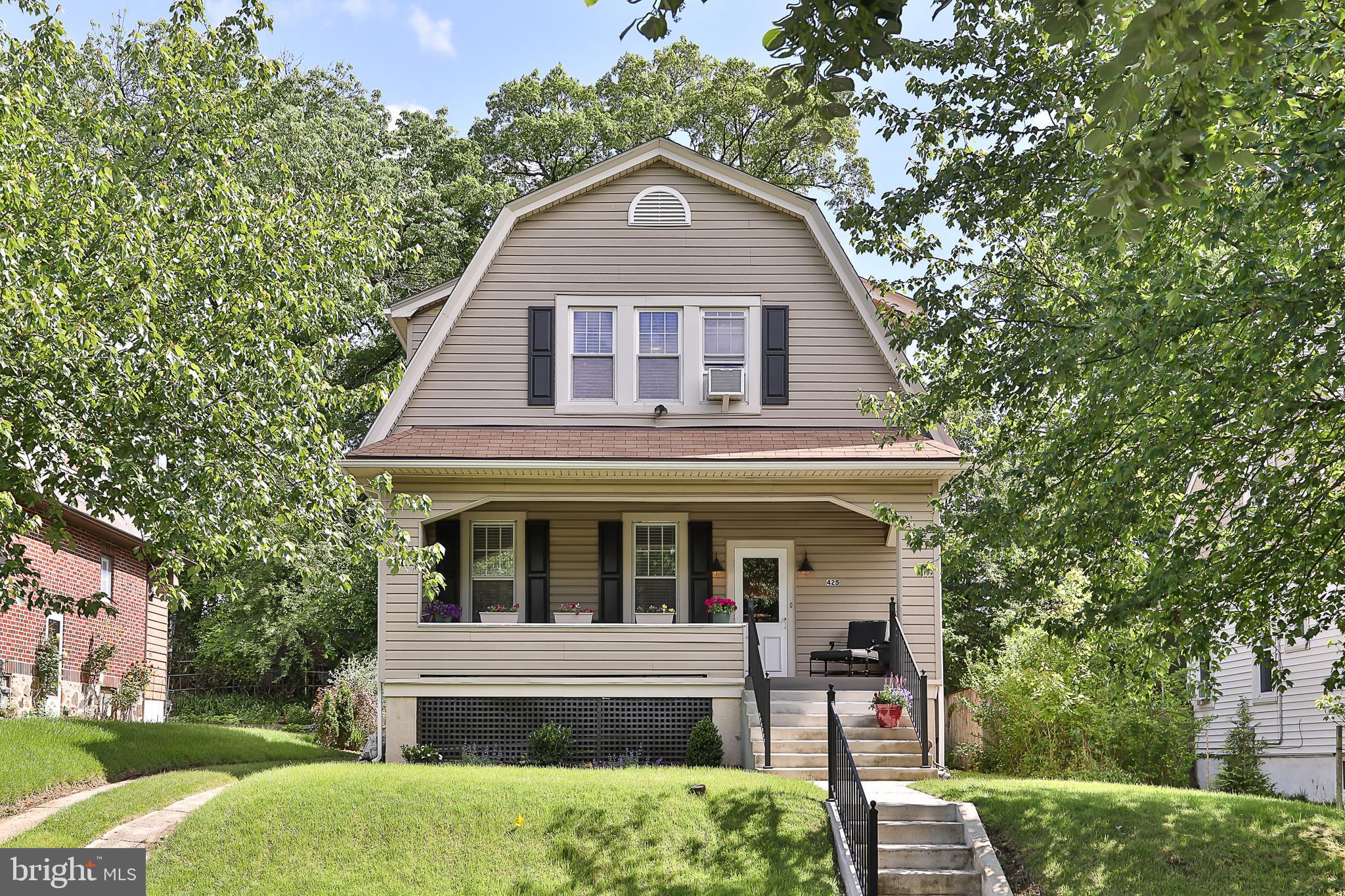 425 Westgate Road Baltimore, MD 21229 - Photo 1 of 32 a front view of a house with garden