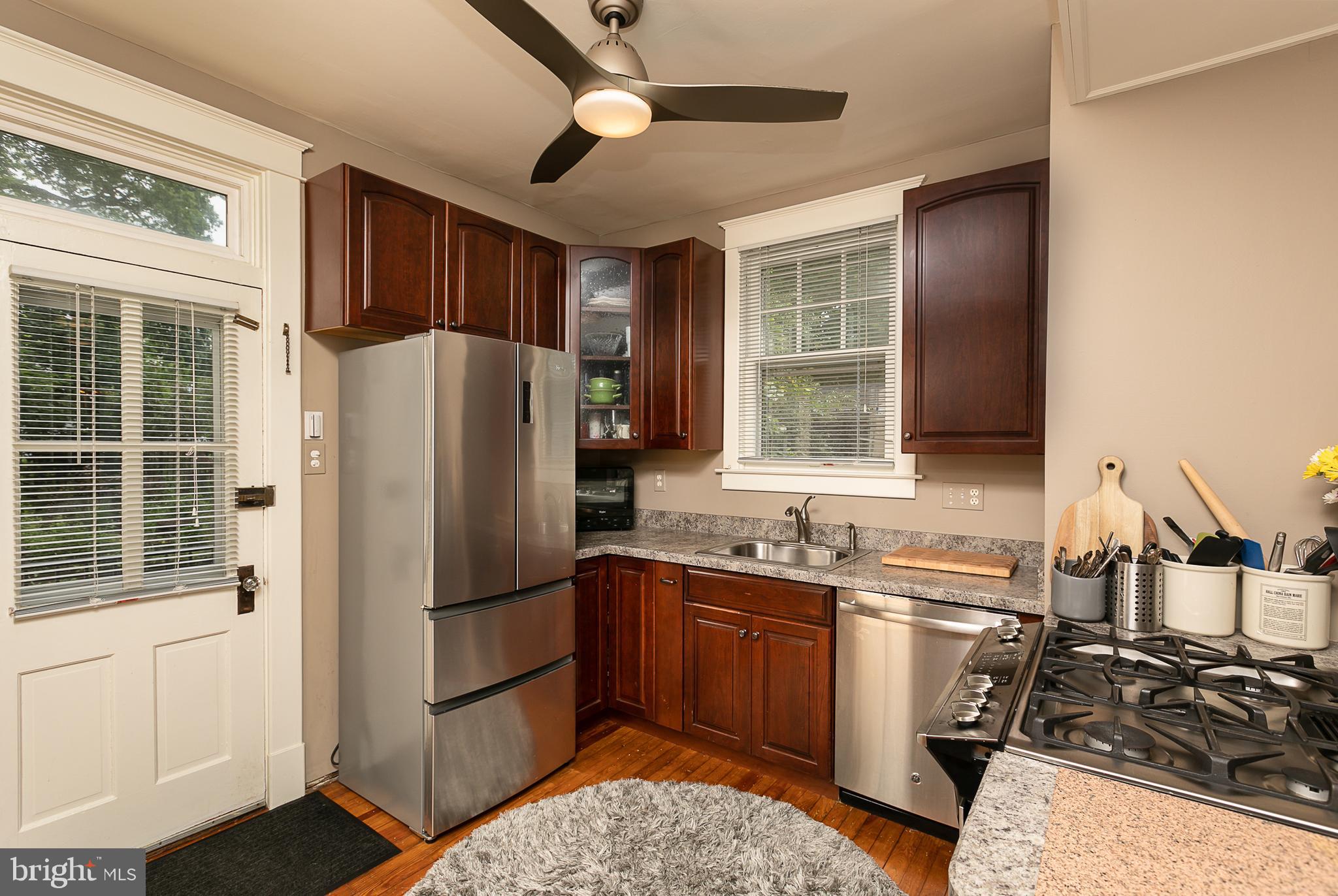 425 Westgate Road Baltimore, MD 21229 - Photo 14 of 32 a kitchen with a sink appliances and cabinets