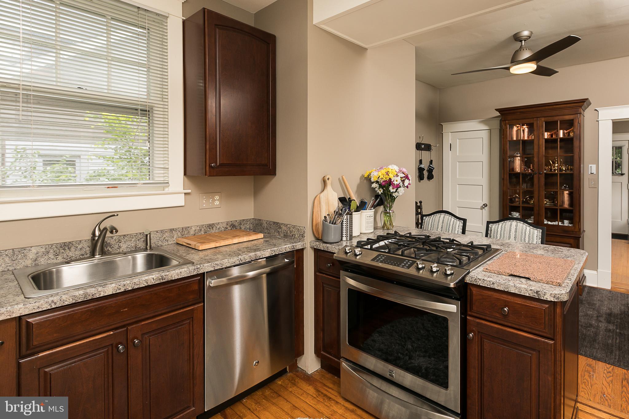 425 Westgate Road Baltimore, MD 21229 - Photo 15 of 32 a kitchen with a stove and a sink