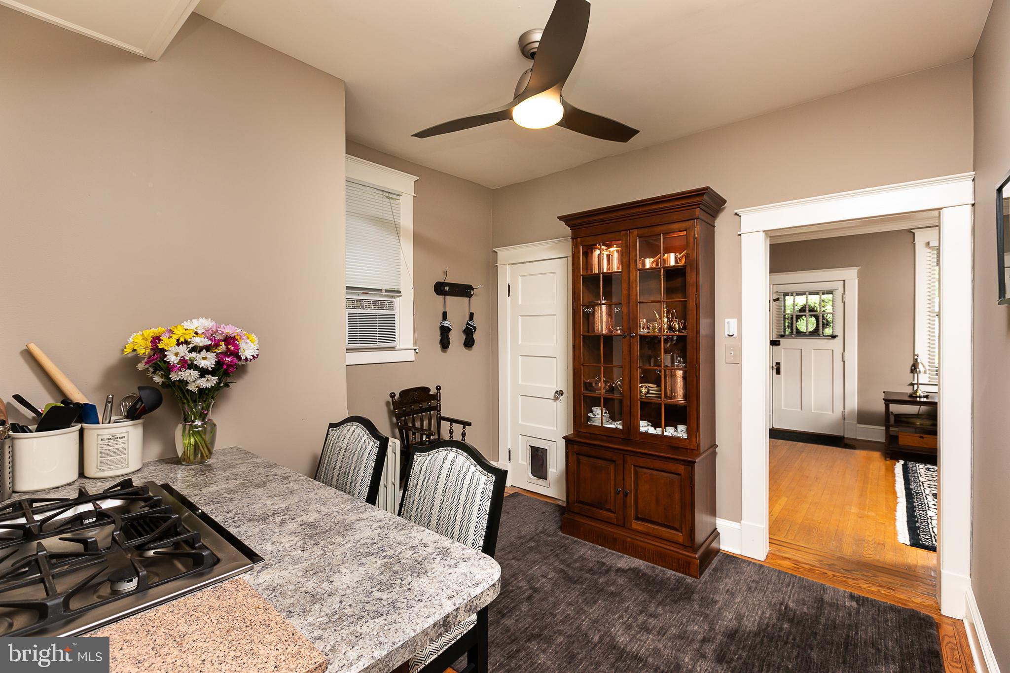 425 Westgate Road Baltimore, MD 21229 - Photo 16 of 32 a view of a dining room with furniture and chandelier