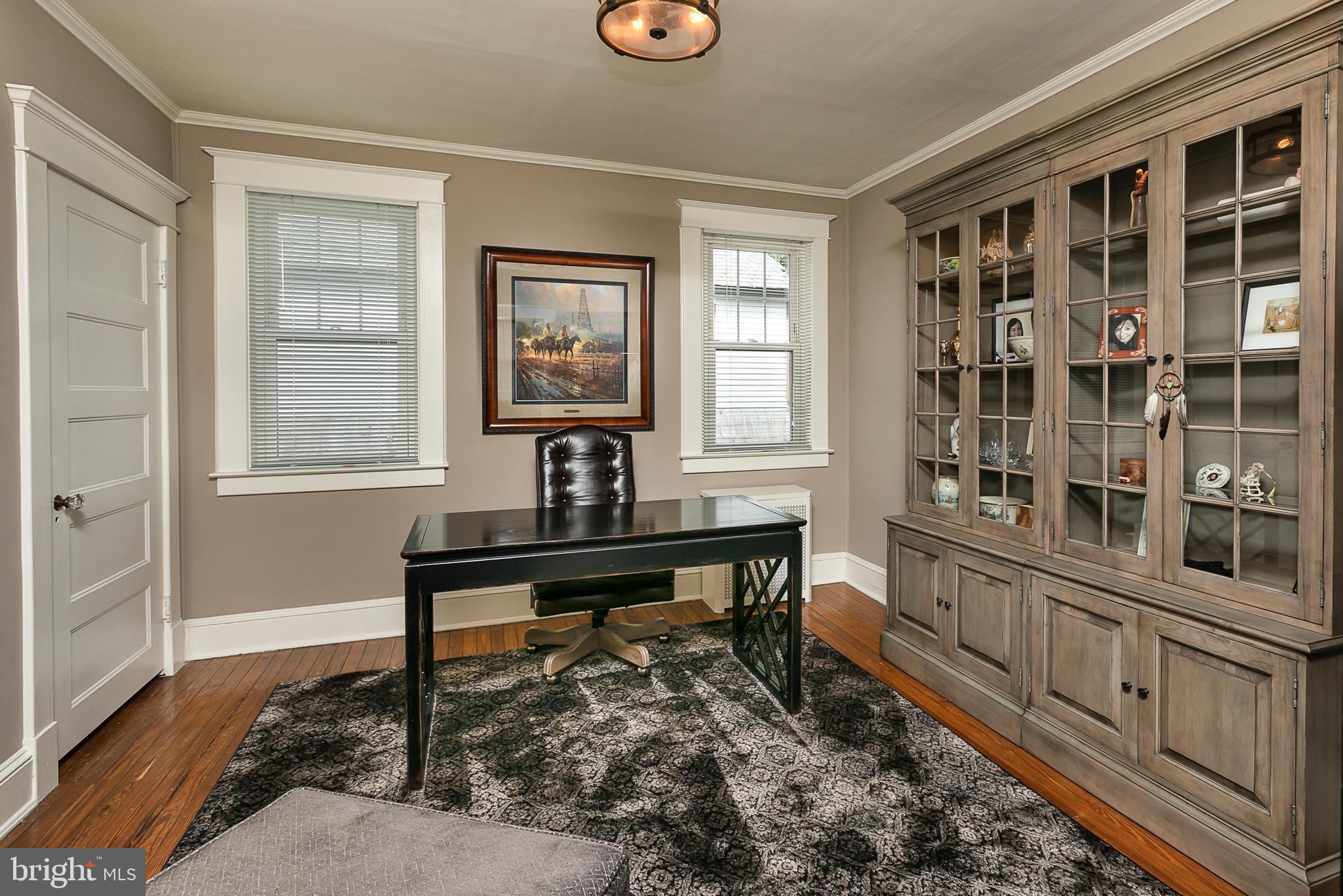 425 Westgate Road Baltimore, MD 21229 - Photo 22 of 32 a view of a workspace with wooden floor and a window