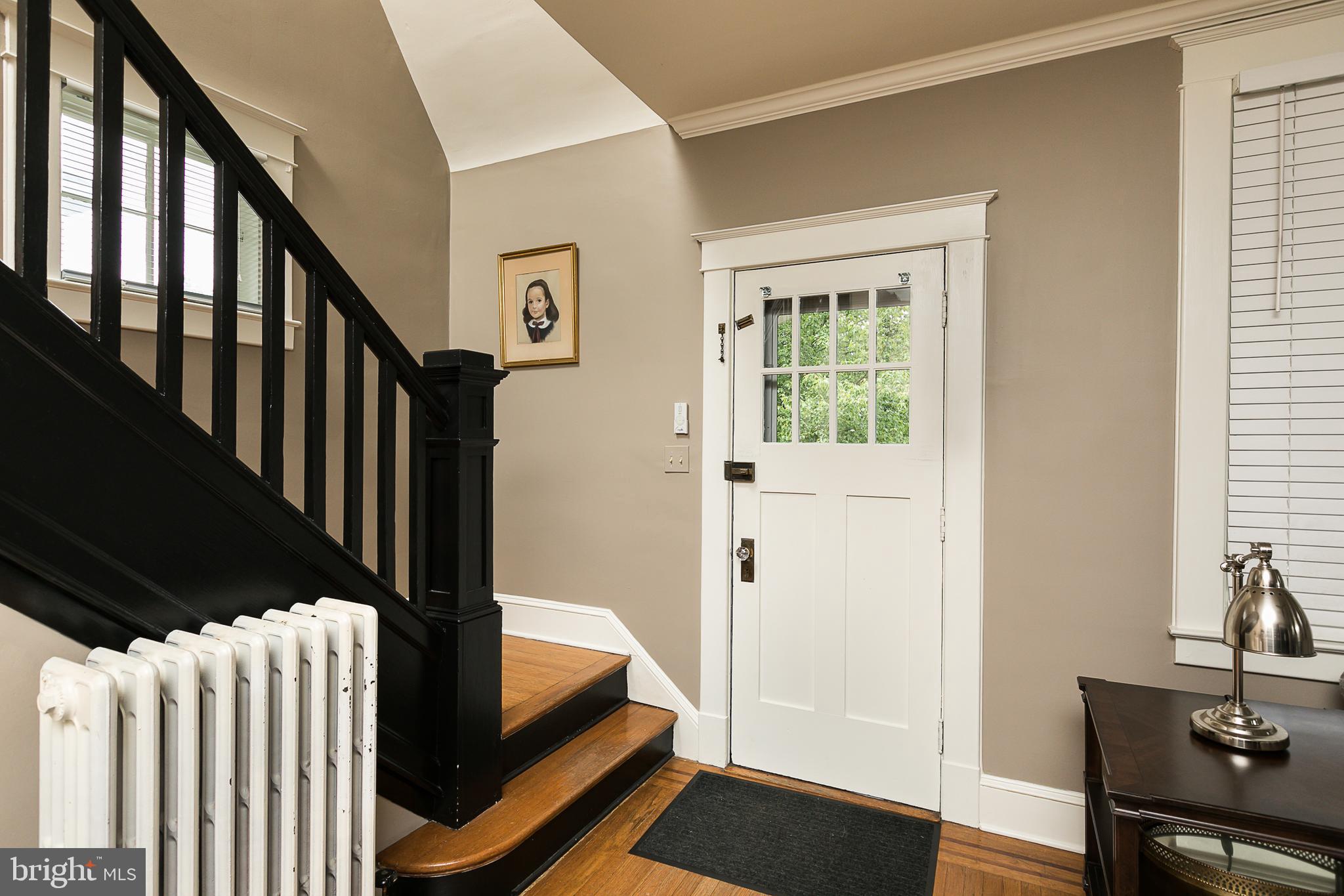 425 Westgate Road Baltimore, MD 21229 - Photo 5 of 32 a view of a hallway with wooden floor and staircase