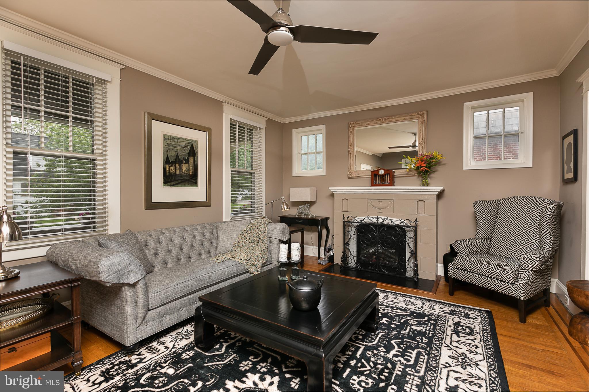 425 Westgate Road Baltimore, MD 21229 - Photo 6 of 32 a living room with furniture and a fireplace