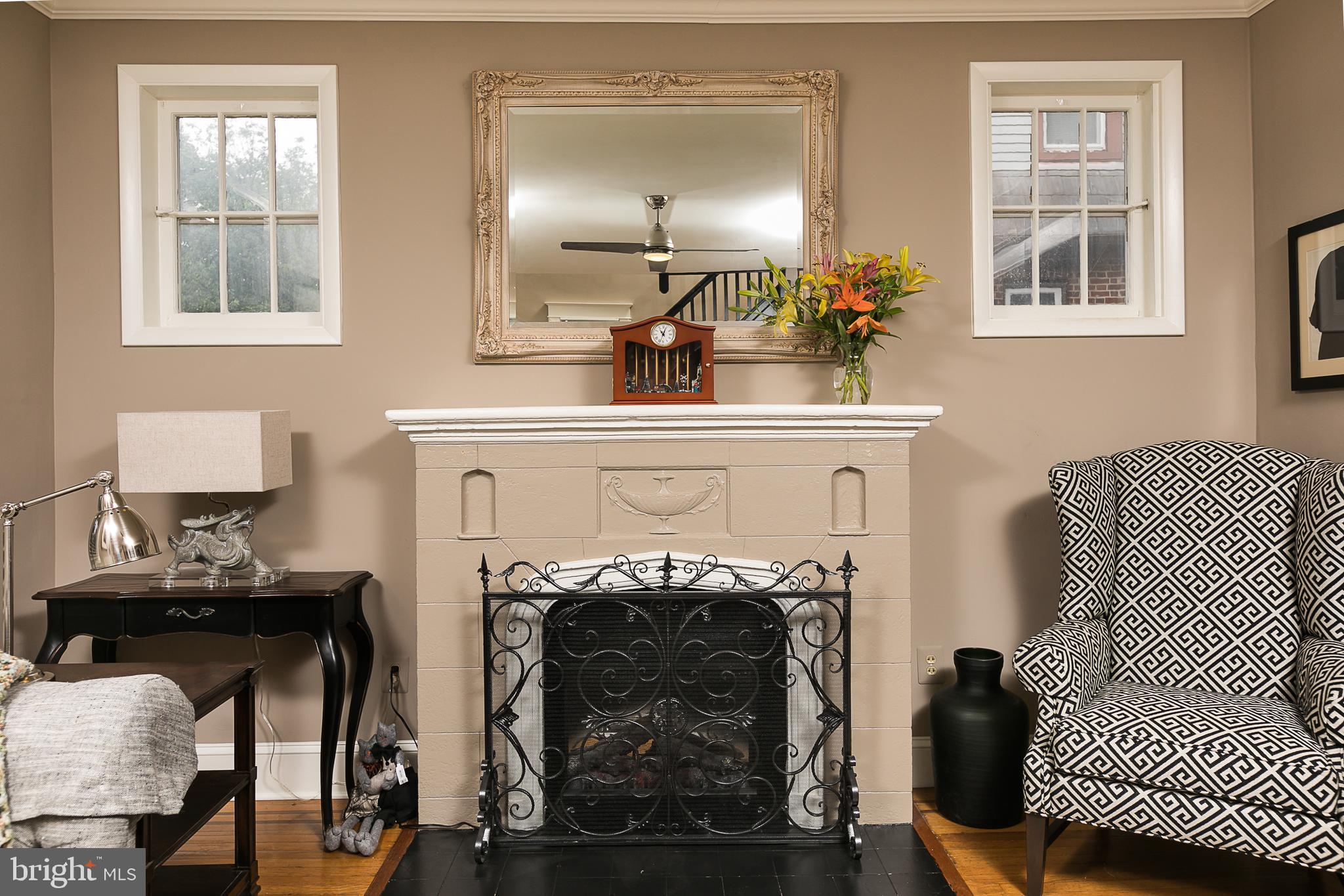 425 Westgate Road Baltimore, MD 21229 - Photo 8 of 32 a living room with furniture and a fireplace