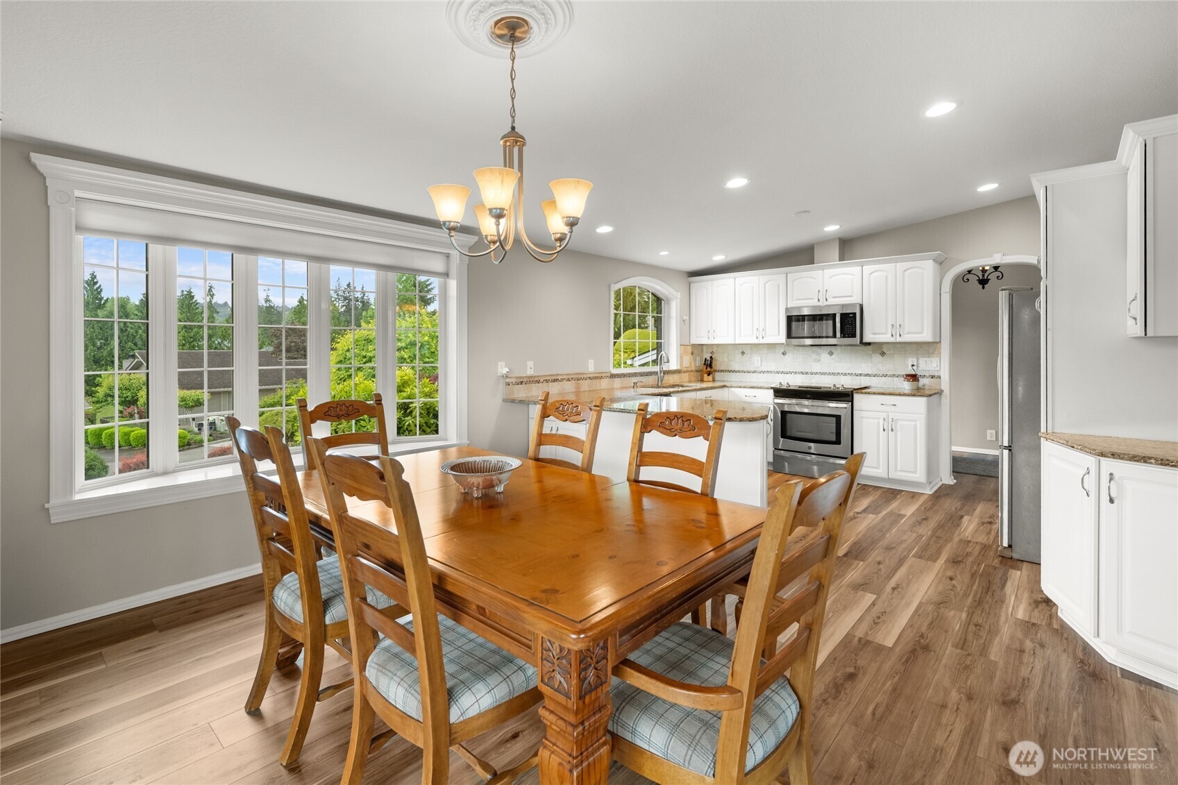 10 Jeffery Place Longview, WA 98632 - Photo 8 of 40 a view of a dining room with furniture large window and wooden floor