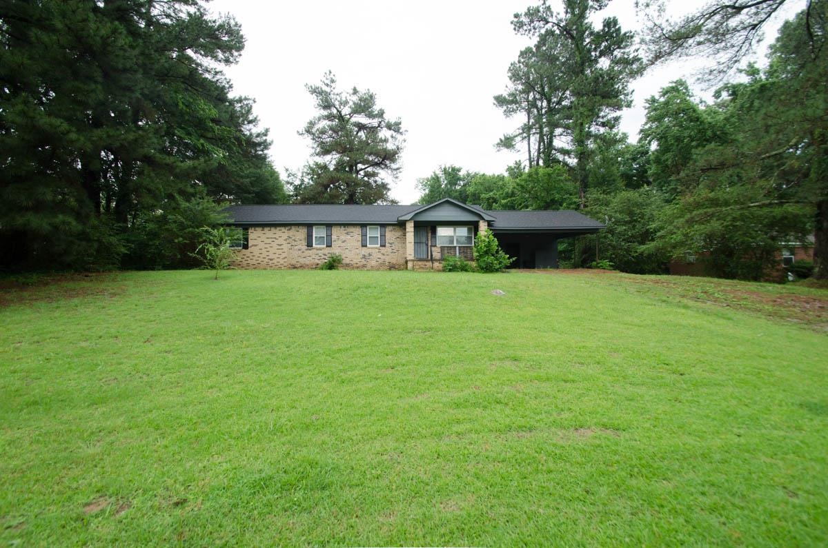 35 Dee Road Somerville, TN 38068 - Photo 1 of 15 Single story home featuring a front lawn, brick siding, and an attached carport