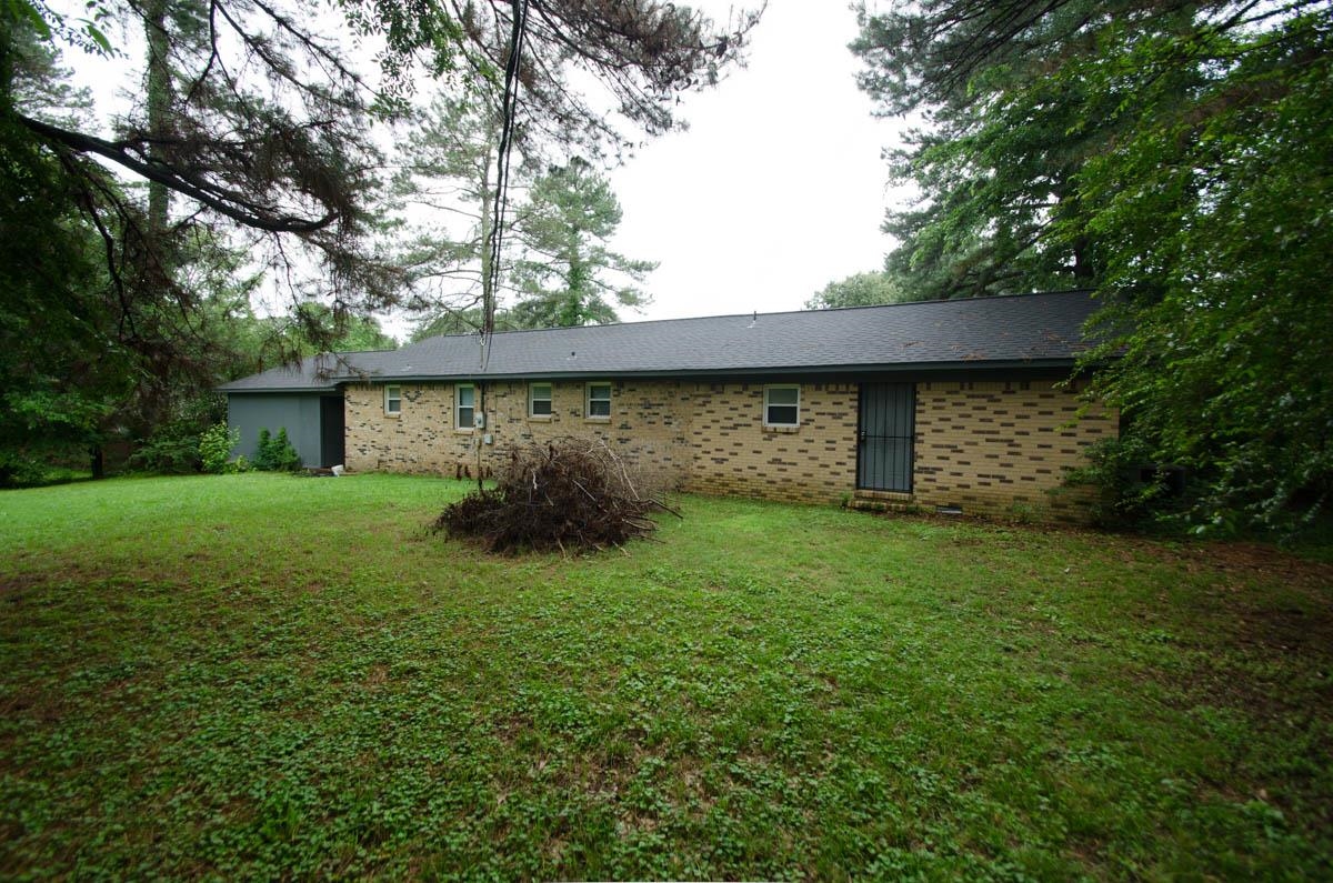 35 Dee Road Somerville, TN 38068 - Photo 15 of 15 Back of house featuring a yard and brick siding