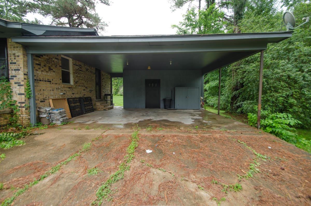 35 Dee Road Somerville, TN 38068 - Photo 3 of 15 View of parking with an attached carport and driveway