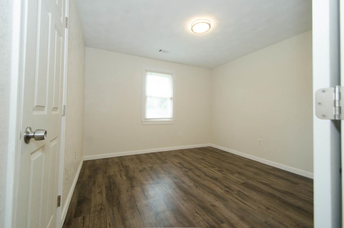 35 Dee Road Somerville, TN 38068 - Photo 10 of 15 Empty room featuring dark wood-style flooring and baseboards