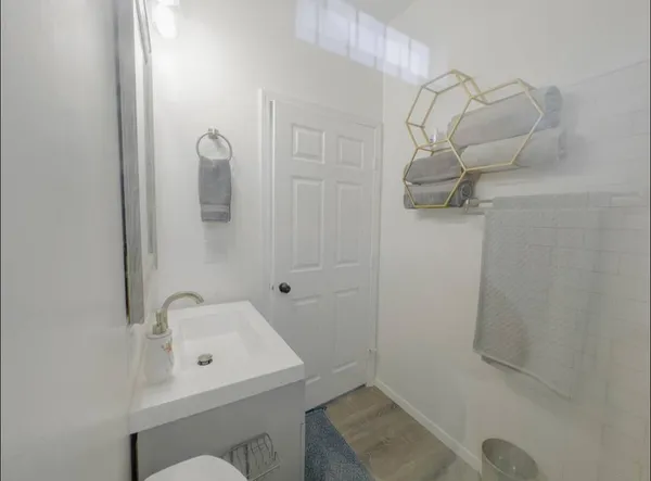 a bathroom with a sink and shower