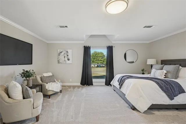 a bedroom with bed and a flat screen tv