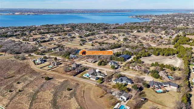 an aerial view of residential building with ocean