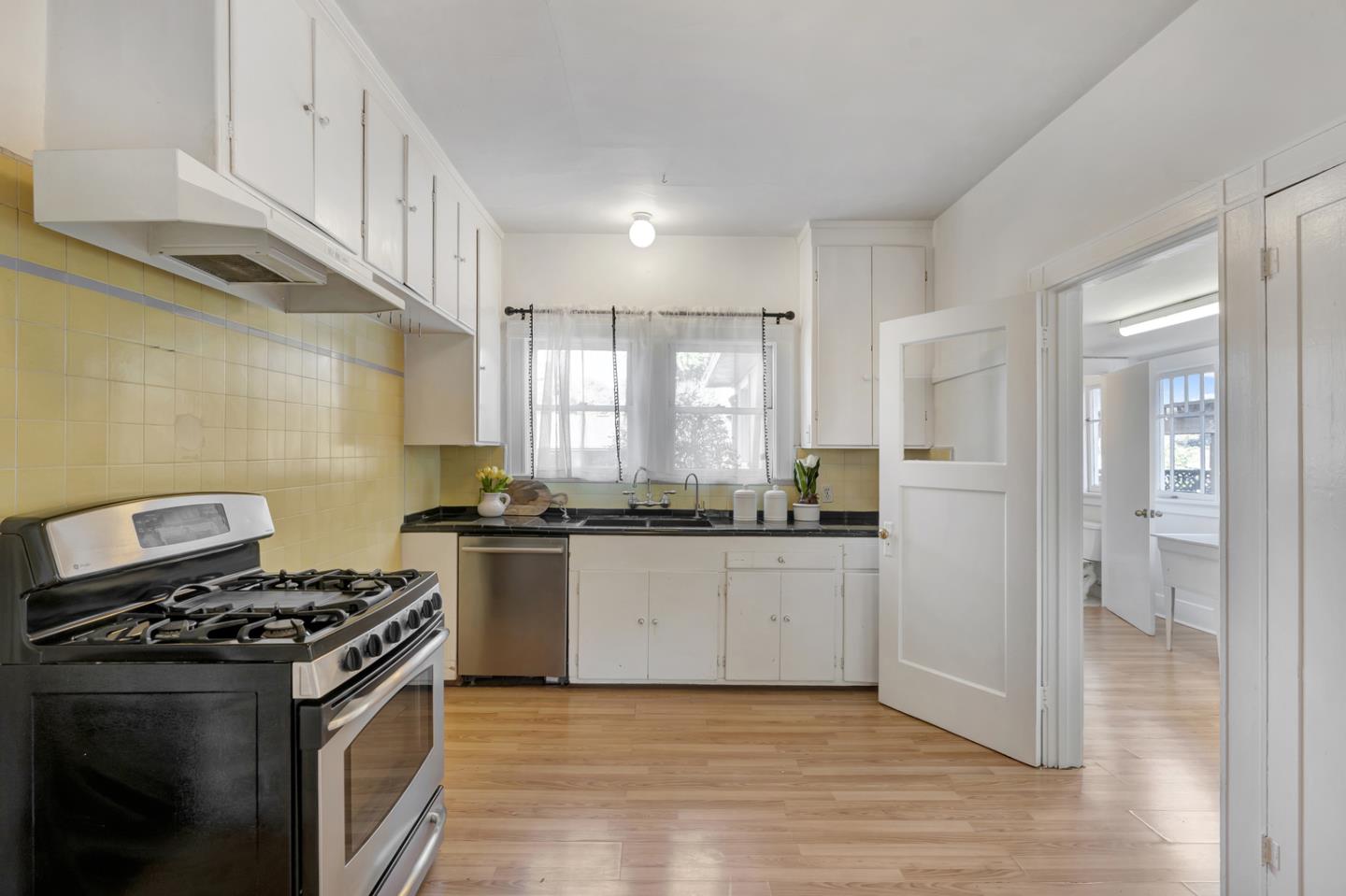 445 Northern Road San Jose, CA 95125 - Photo 16 of 42 a kitchen with stainless steel appliances granite countertop a stove and a refrigerator