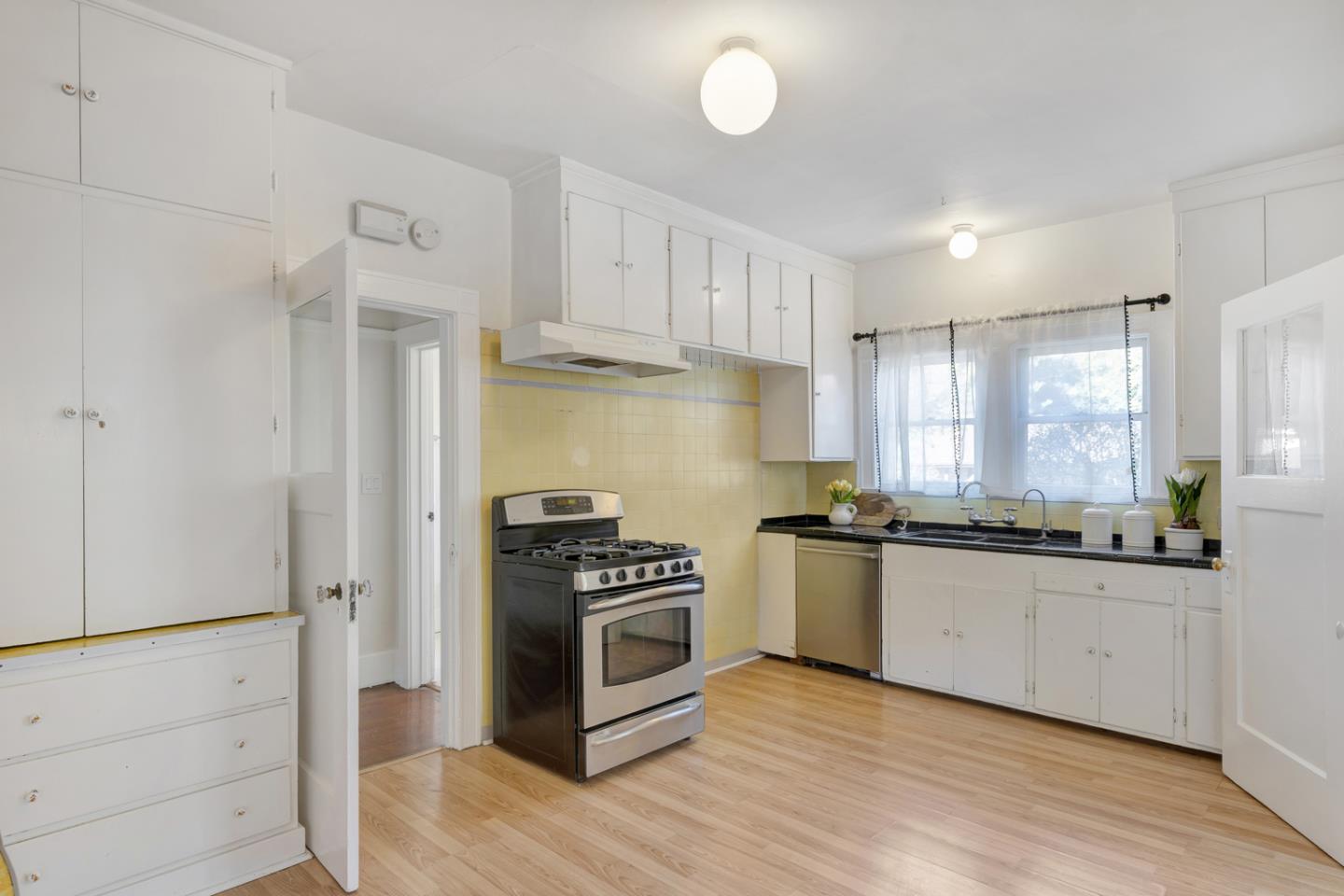 445 Northern Road San Jose, CA 95125 - Photo 17 of 42 a kitchen with granite countertop a sink and a stove top oven