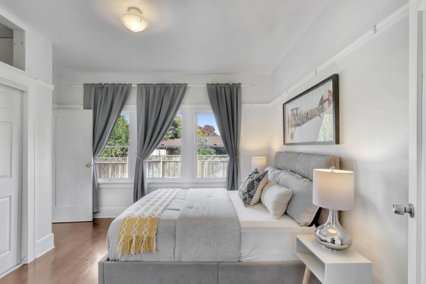 445 Northern Road San Jose, CA 95125 - Photo 22 of 42 a bedroom with a bed and a large window