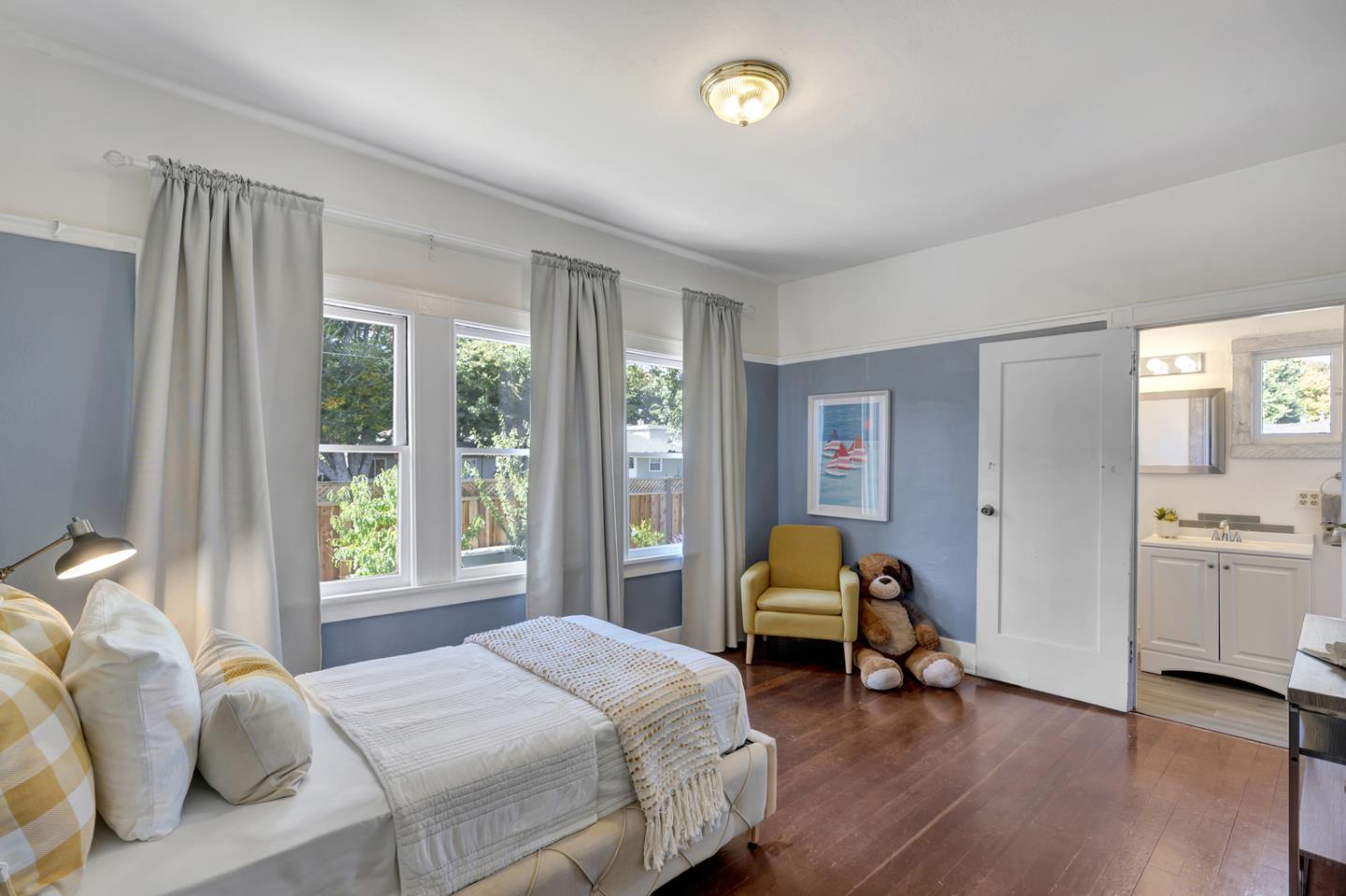 445 Northern Road San Jose, CA 95125 - Photo 26 of 42 a bedroom with a bed and wooden floor