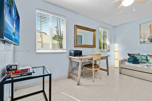 a bedroom with a bed and a couch