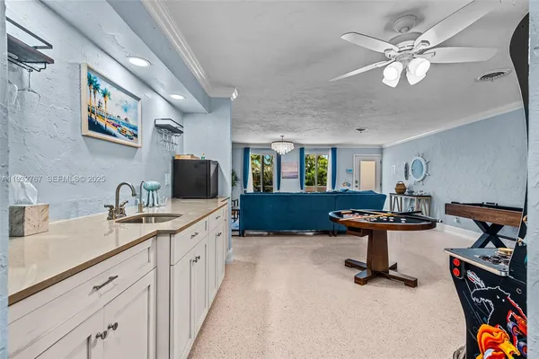 a kitchen with lots of counter top space and dining table