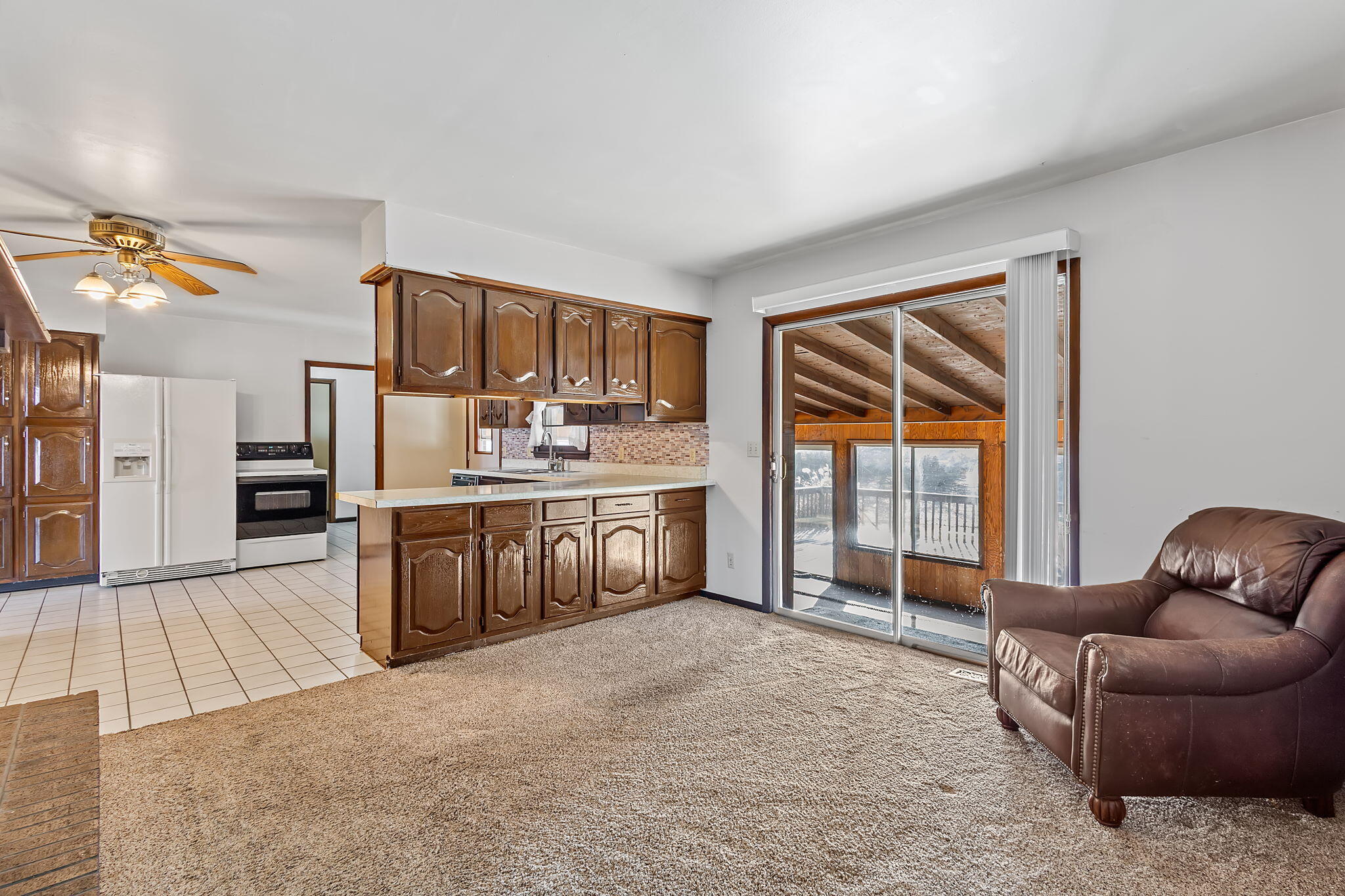 6801 West 1350th Street North Demotte, IN 46310 - Photo 11 of 44 a large room with stainless steel appliances kitchen island granite countertop a refrigerator a stove a sink dishwasher with a dining table and chair with wooden floor