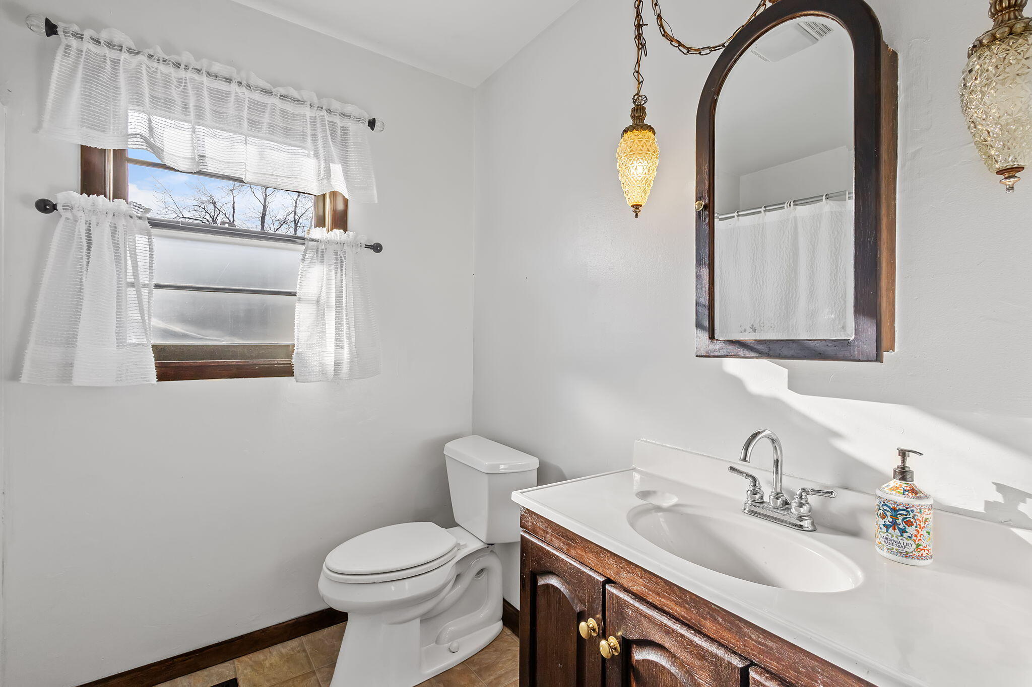 6801 West 1350th Street North Demotte, IN 46310 - Photo 15 of 44 a bathroom with a sink a toilet and mirror