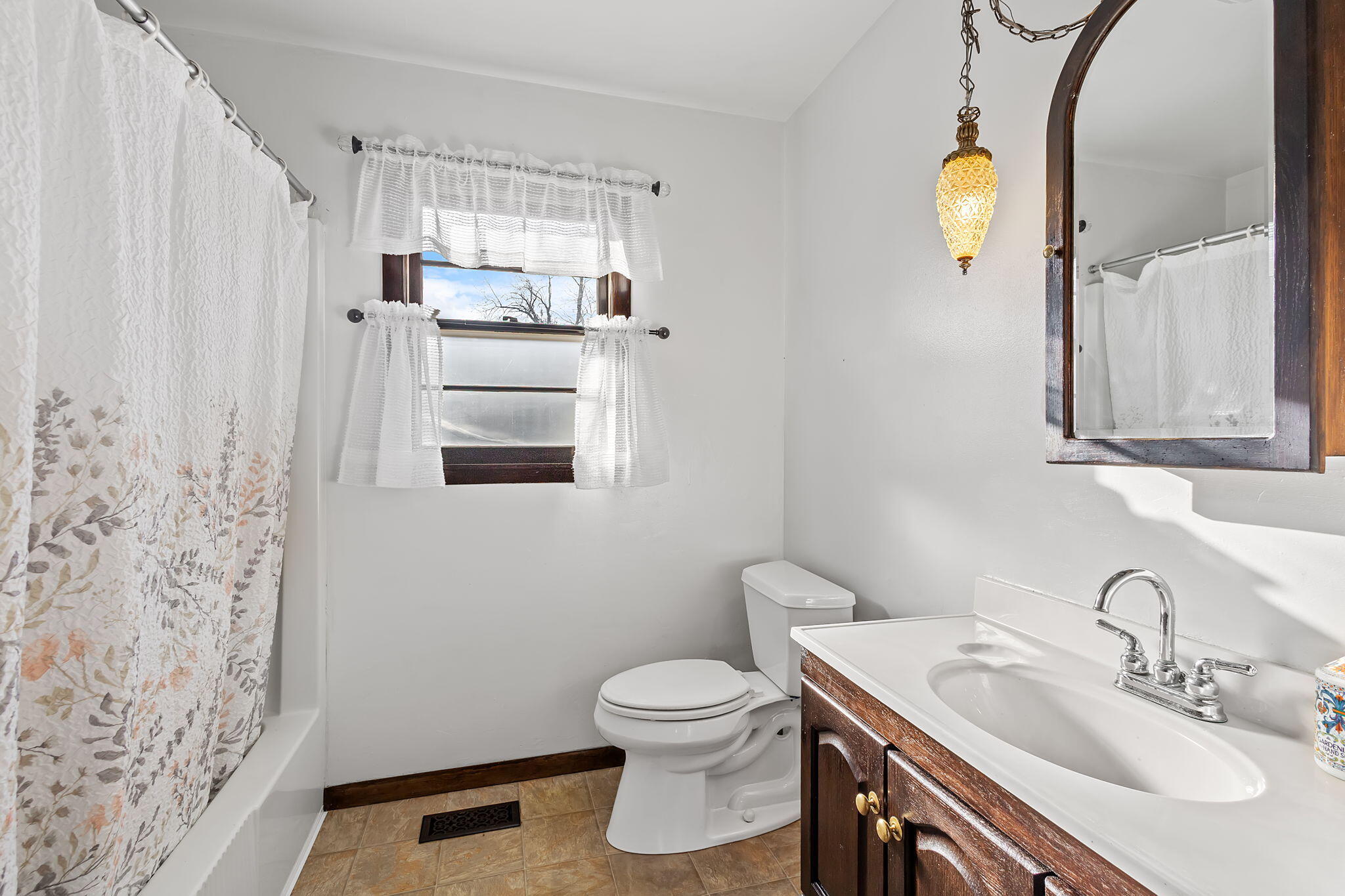 6801 West 1350th Street North Demotte, IN 46310 - Photo 16 of 44 a bathroom with a sink a toilet and mirror