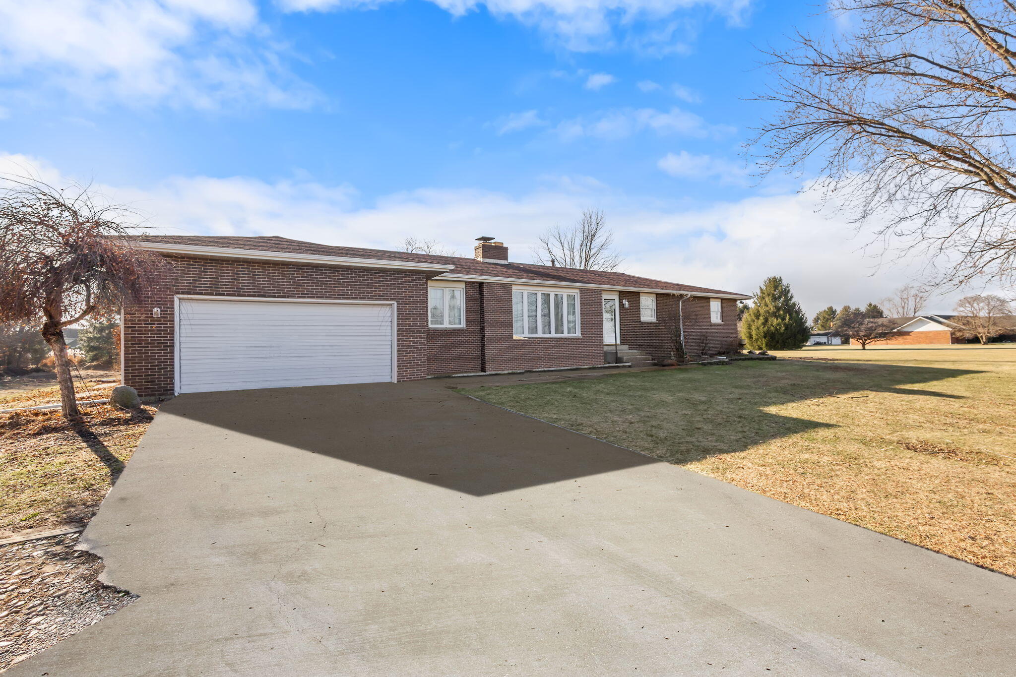 6801 West 1350th Street North Demotte, IN 46310 - Photo 2 of 44 a front view of a house with a yard and garage