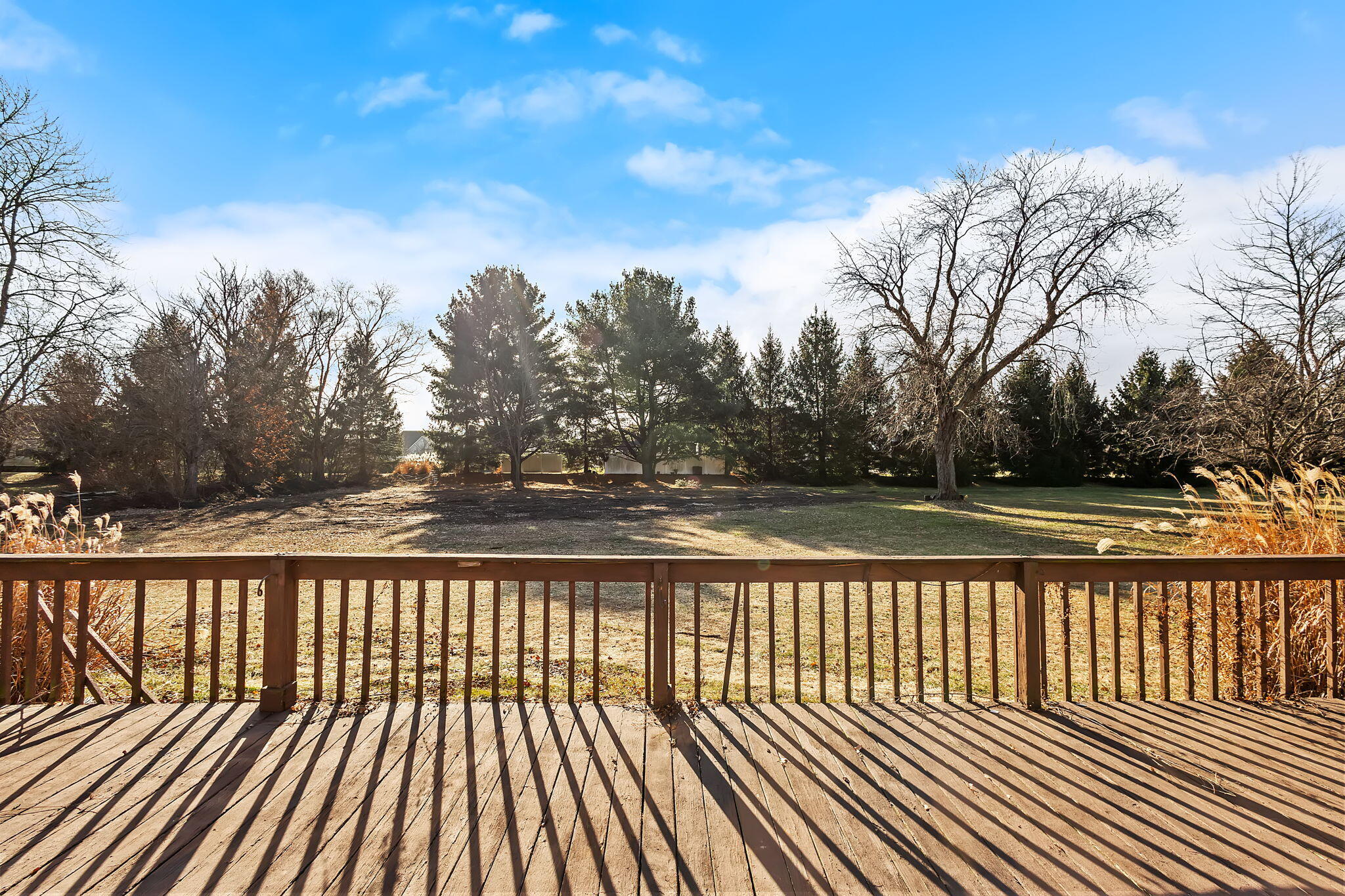 6801 West 1350th Street North Demotte, IN 46310 - Photo 30 of 44 a view of balcony with wooden floor and fence