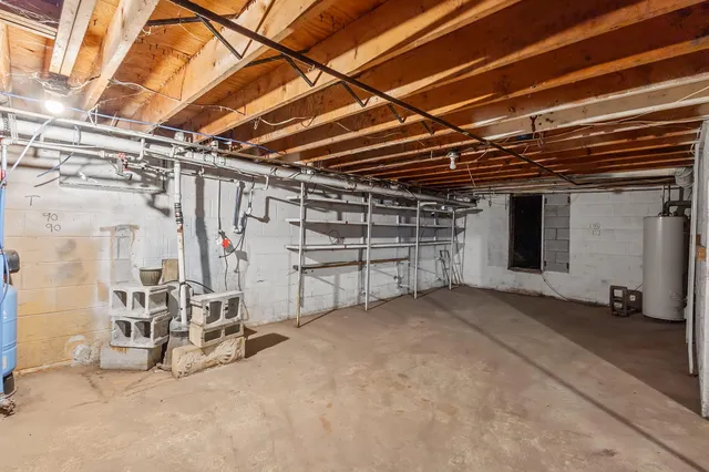 a view of empty room with wooden ceiling