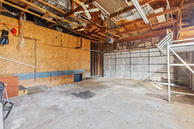 a view of an empty room with a garage