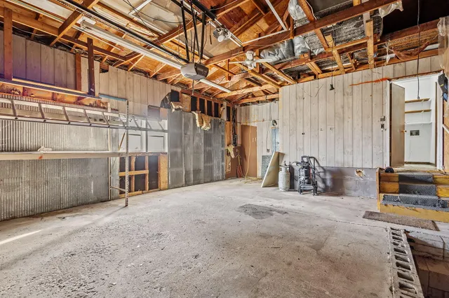 a view of a room with wooden walls