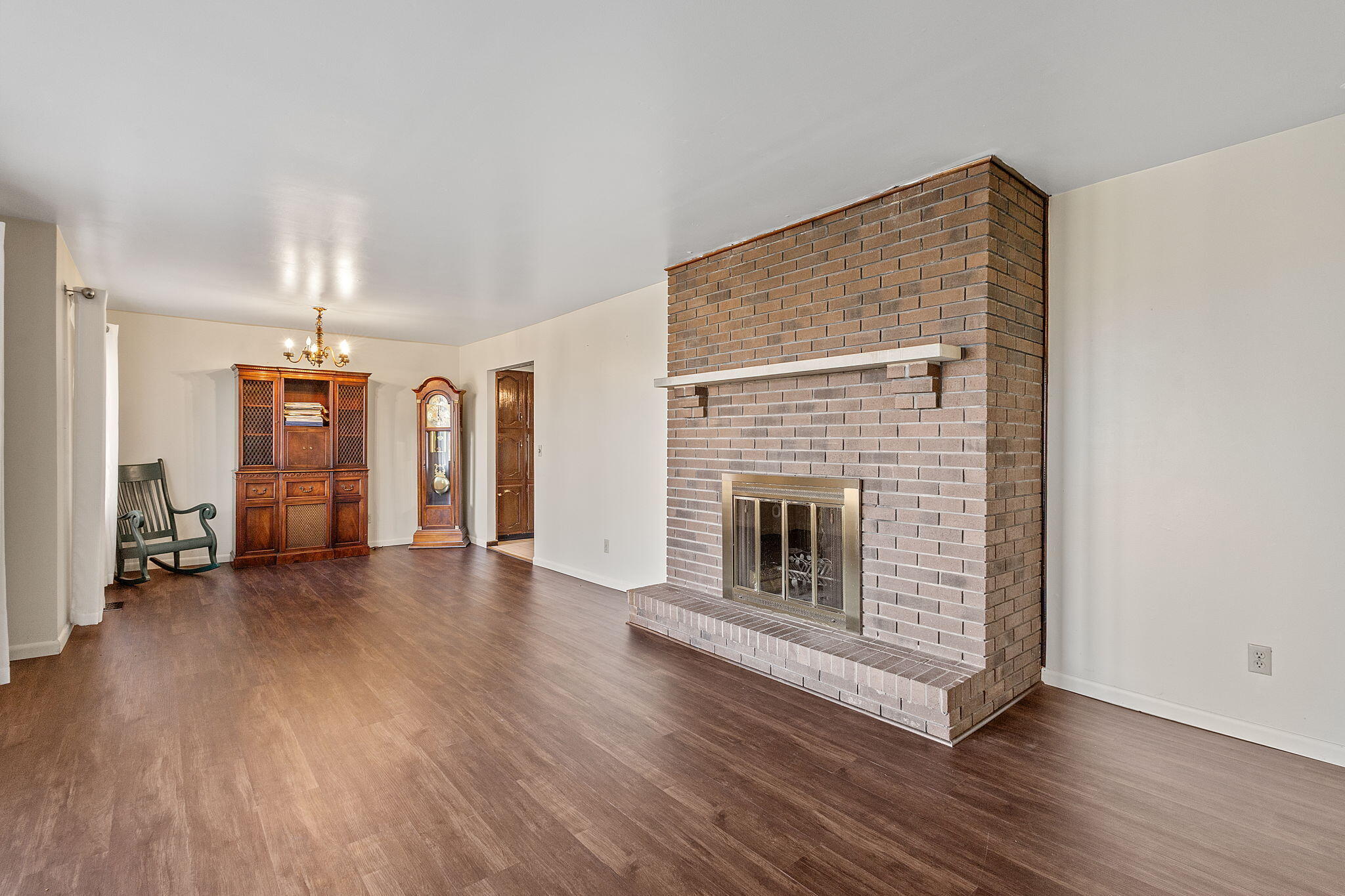 6801 West 1350th Street North Demotte, IN 46310 - Photo 6 of 44 a view of a livingroom with wooden floor and a fireplace