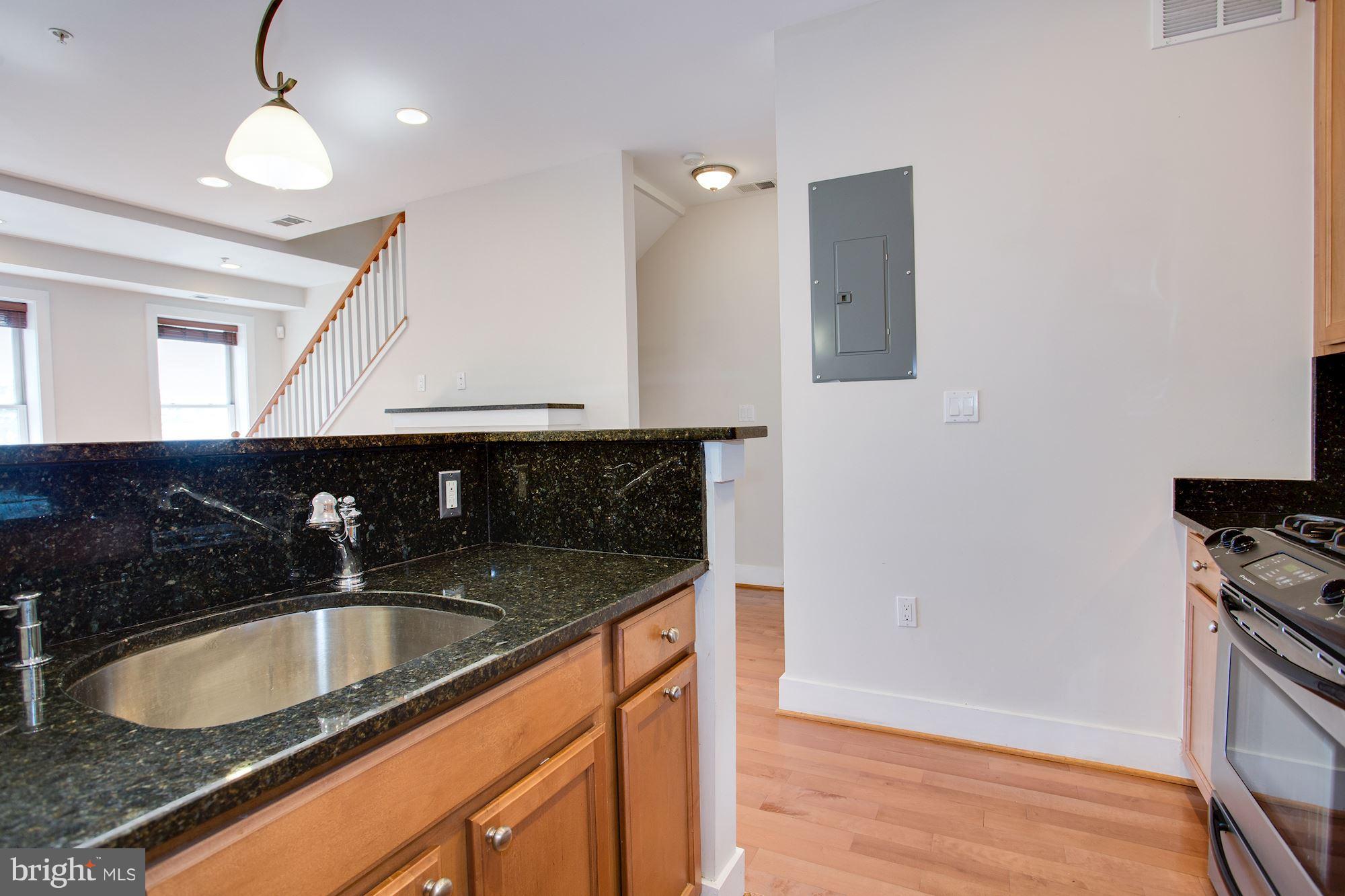 1912 4th Street Northeast, Unit 2 Washington, DC 20002 - Photo 8 of 23 a bathroom with a sink and a mirror