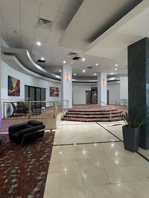 6345 Collins Avenue, Unit 614 Miami Beach, FL 33141 - Photo 4 of 12 a lobby with a couch and a rug