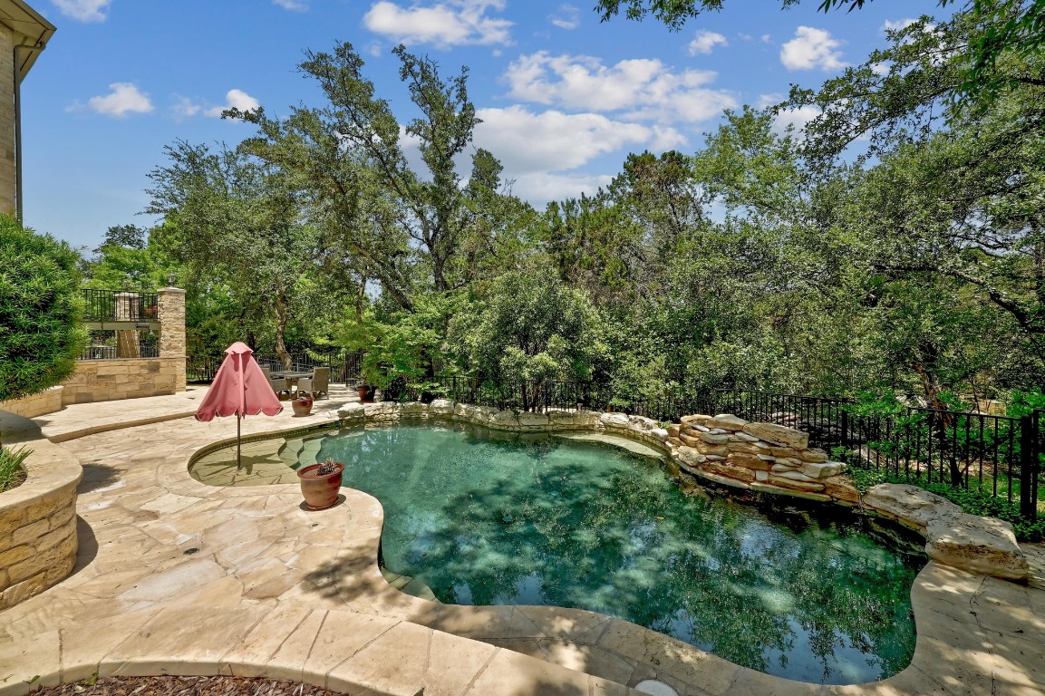 A sparkling in-ground pool provides the perfect place to cool off during warm Texas summers.