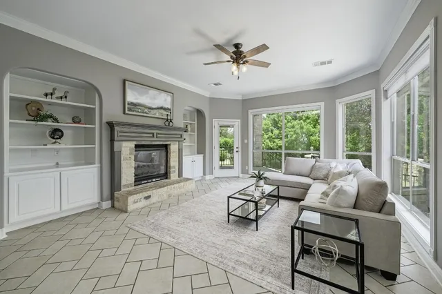 a room with a sink a mirror and a window