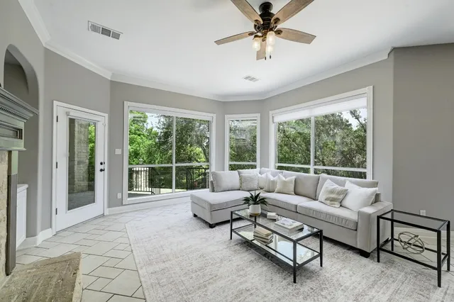 a bathroom with a granite countertop sink a toilet and a mirror