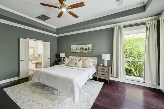 a bedroom with furniture and a window